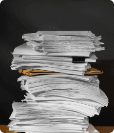 A pile of documents representing paperwork
